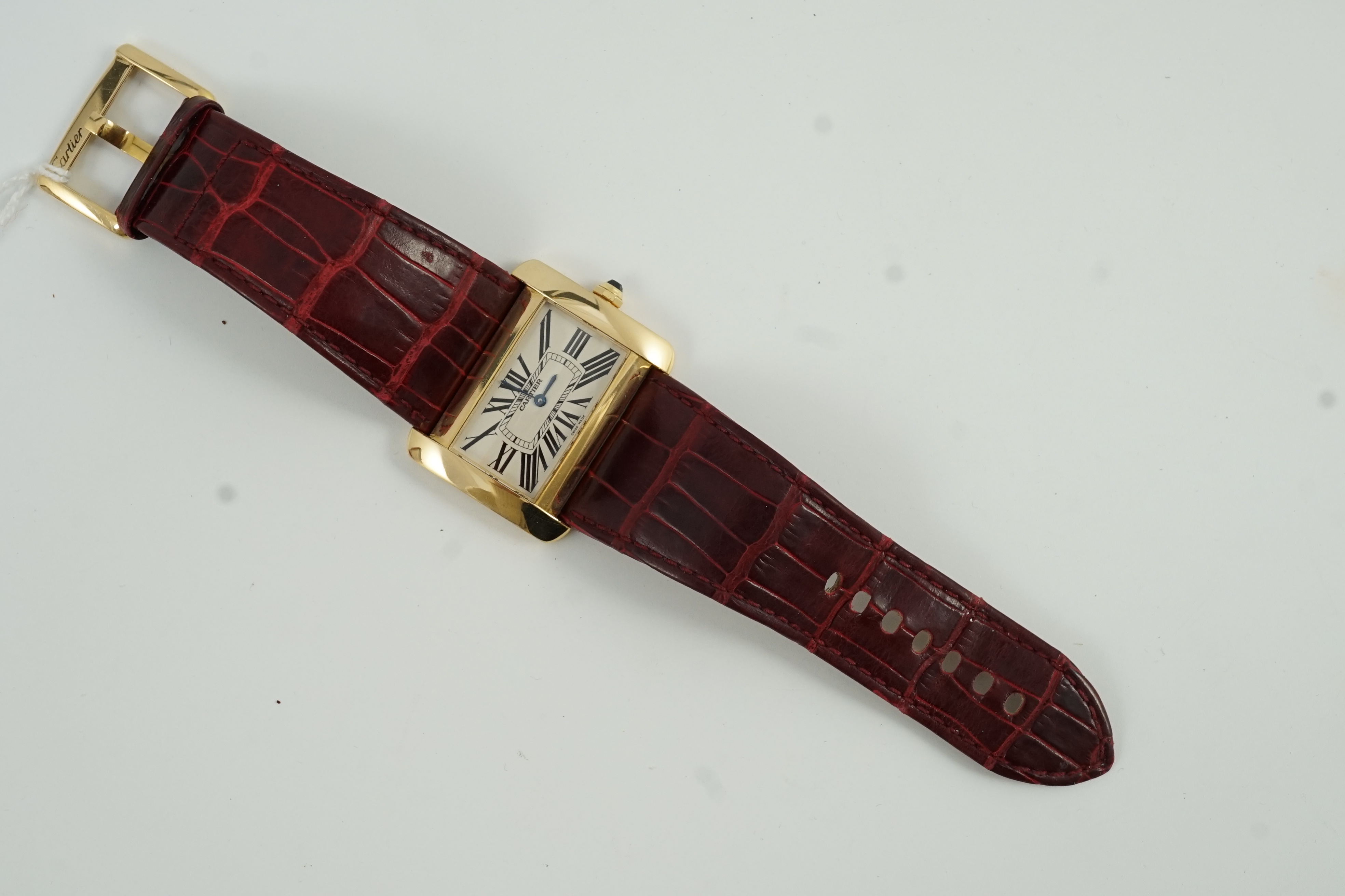 A gentleman's modern 18ct gold Cartier Tank Divan quartz wrist watch